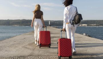 full-shot-women-traveling-with-luggage